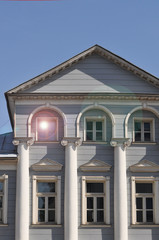 urban environment. a striking mansion with an attic and columns
