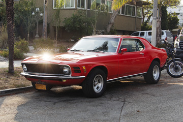 A view of a vintage classic American red car in the street in LA