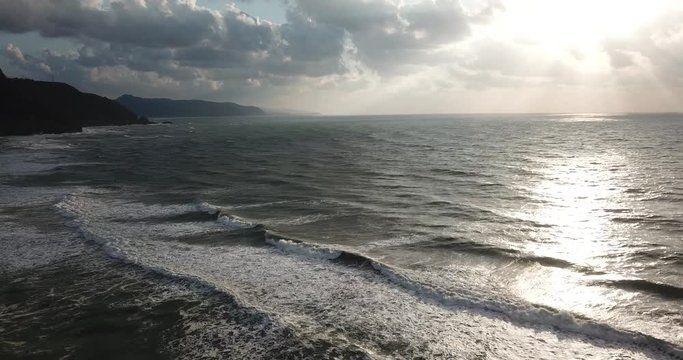 Shot of a beautiful summer sunset at the beach. Sunset at sea drone footage