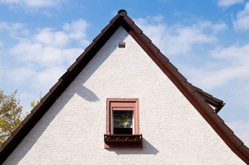 Peak roof and a window