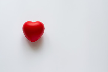 Close up red heart symbol of love isolated on white backgroound.  Hand holds red heart. St. Valentines day. Objecr photography. Health and cardiovascular risk of diseases. Cardiology news. 