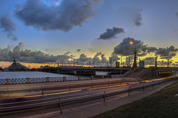 Fototapeta premium Night view on the illuminated riverside in Riga