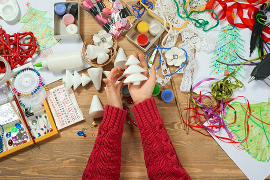 Childrens making decorations for new year holiday. Painting watercolors. Top view. Artwork workplace with creative accessories.