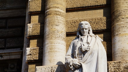 detail of a thinker and jurist statue in front of the Palazzo della Cassazione in Rome