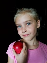 A girl and an apple.