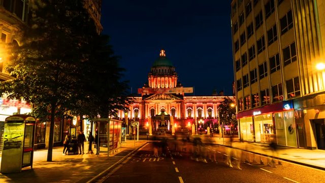 Belfast, UK. Nightlife with city hall in Belfast, UK the capital of Northern Ireland. Time-lapse of car traffic ar night with dark blue sky