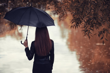 Young girl in autumn park