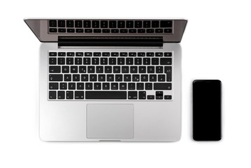 Top view of laptop with smartphone, isolated on white