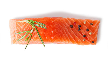 Raw salmon fillets with spices isolated on a white background. Top view.
