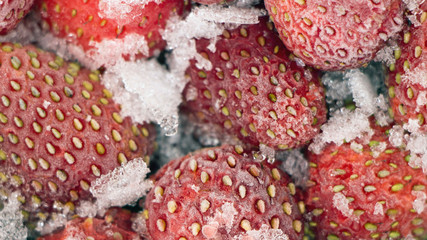 Strawberry covered with ice crust. Background