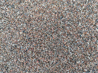 Coarse sand background. Large and small stones. Background.