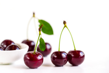 ripe cherries on a white background