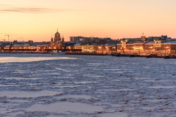 Fototapeta na wymiar View of Lieutenant Schmidt Embankment at sunset in winter. Saint Petersburg. Russia