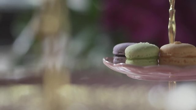 Closeup beautiful cookies macaroon on glass dessert stand on event party
