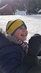 happy kid playing in snow