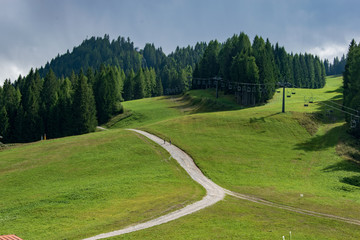 Beautiful mountain road and a chairlift installation in Auronzo di Cadore italy 