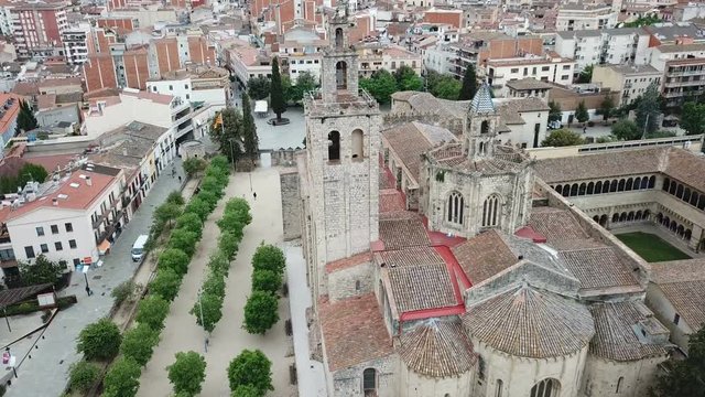 View from drone of ancient Benedictine abbey in Sant Cugat del Valles, Catalonia, Spain