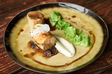 Duck galantine, mushroom fricassee, young cabbage and sauce. chicken sausage with baked green cabbage. Healthy diet food concept.