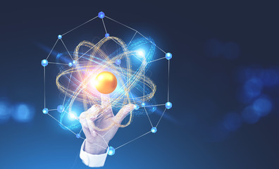 Woman hand touching atom model hologram