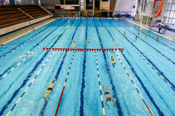 Fototapeta na wymiar Indoor swimming pool in sport club. Swimming and aqua aerobics training. Healthy lifestyle concept.
