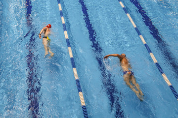 Indoor swimming pool in sport club. Swimming training. Healthy lifestyle concept.