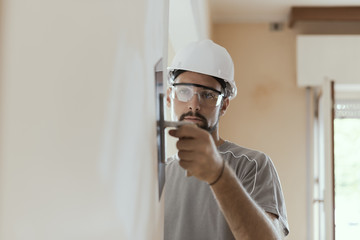 Professional craftsman applying plaster with a trowel