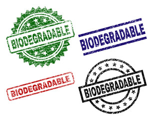BIODEGRADABLE seal prints with corroded style. Black, green,red,blue vector rubber prints of BIODEGRADABLE tag with corroded style. Rubber seals with circle, rectangle, rosette shapes.
