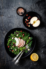 Kale salad with dried cranberry, hazelnuts and sliced apple
