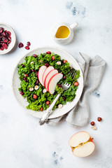 Kale salad with dried cranberry, hazelnuts and sliced apple