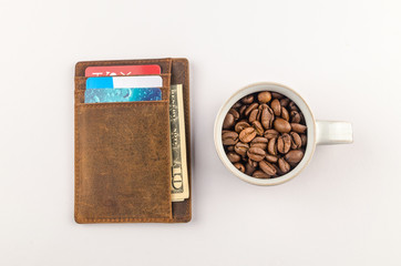Coffee cup full of grains with wallet
