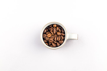 Obraz na płótnie Canvas Coffee cup full of grains