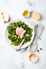 Kale salad with dried cranberry, hazelnuts and sliced apple