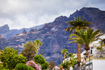 Fototapeta na wymiar 10 of May 2018 - Tenerife, Spain. Cityscape view of Los Gigantes cliffs