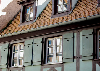 View at old houses with windows in autumn season. Strasburg, France