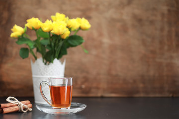 A cup with tea on the table