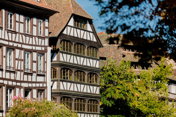 View at old houses with windows in autumn season. Strasburg, France