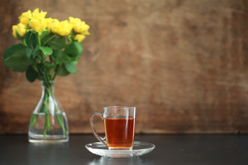 A cup with tea on the table