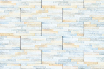 surface of light gray and beige textured brick wall background