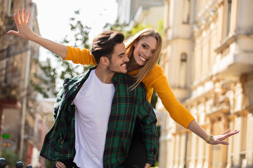 Smiling beautiful couple dating outdoors.