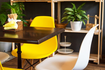 Table in cafe shelf with plants interior
