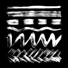 Stripes, lines, waves drawn in white chalk on a black background