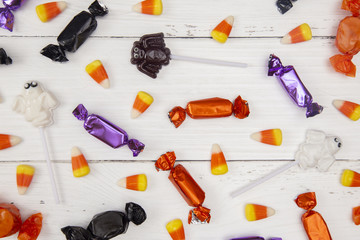 Halloween Candy Background on a White Wood Table