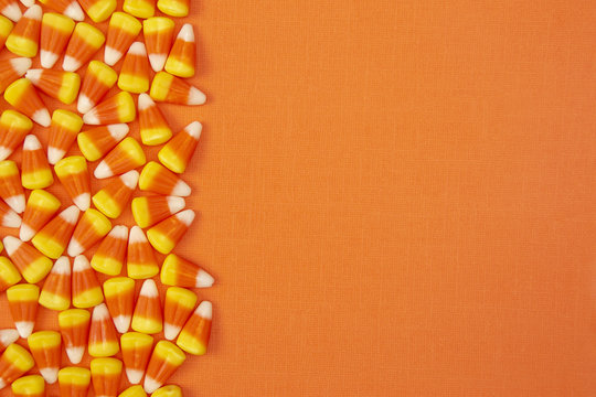 Halloween Candy Background on an Orange Surface