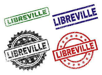 LIBREVILLE seal prints with corroded texture. Black, green,red,blue vector rubber prints of LIBREVILLE label with scratched texture. Rubber seals with circle, rectangle, rosette shapes.