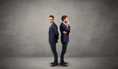 Fototapeta premium Young conflicted businessman choosing between two directions