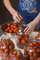 process of home canning ripe tomatoes in the cans