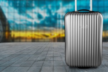 Big travel suitcase on background