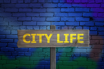 City Life sign in downtown alleyway.