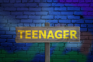 Fototapeta na wymiar Teenager sign on graffiti backgroudn