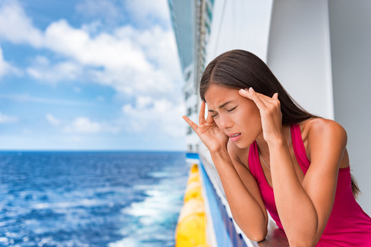 Sea sickness tourist woman seasick on cruise ship travel vacation feeling ill with nausea and headache migraine. Holiday anxiety or fear, seasickness concept.